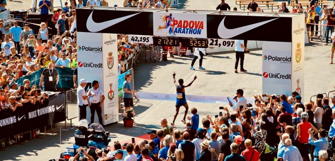 People crossing the finishing line in a marathon
